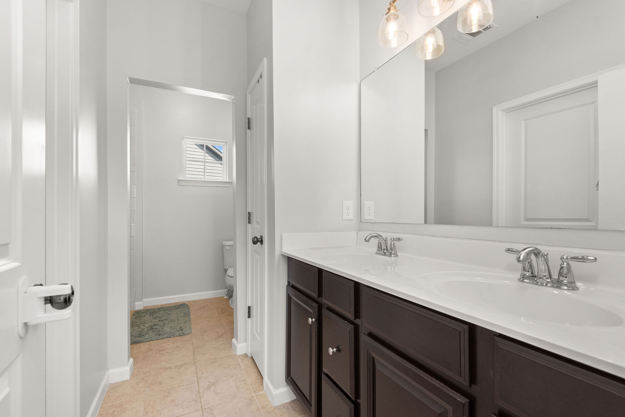 620 Streamside Lane Franklin, TN 37064 - Photo 28 of 45 a bathroom with a double vanity sink mirror and double