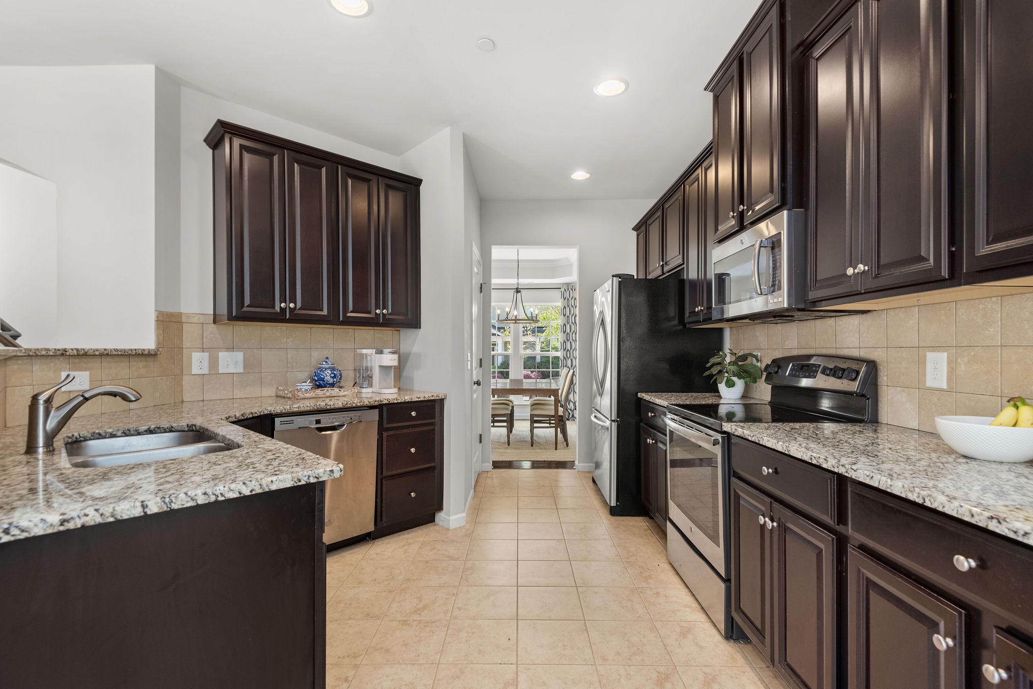 620 Streamside Lane Franklin, TN 37064 - Photo 10 of 45 a kitchen with granite countertop stainless steel appliances and sink