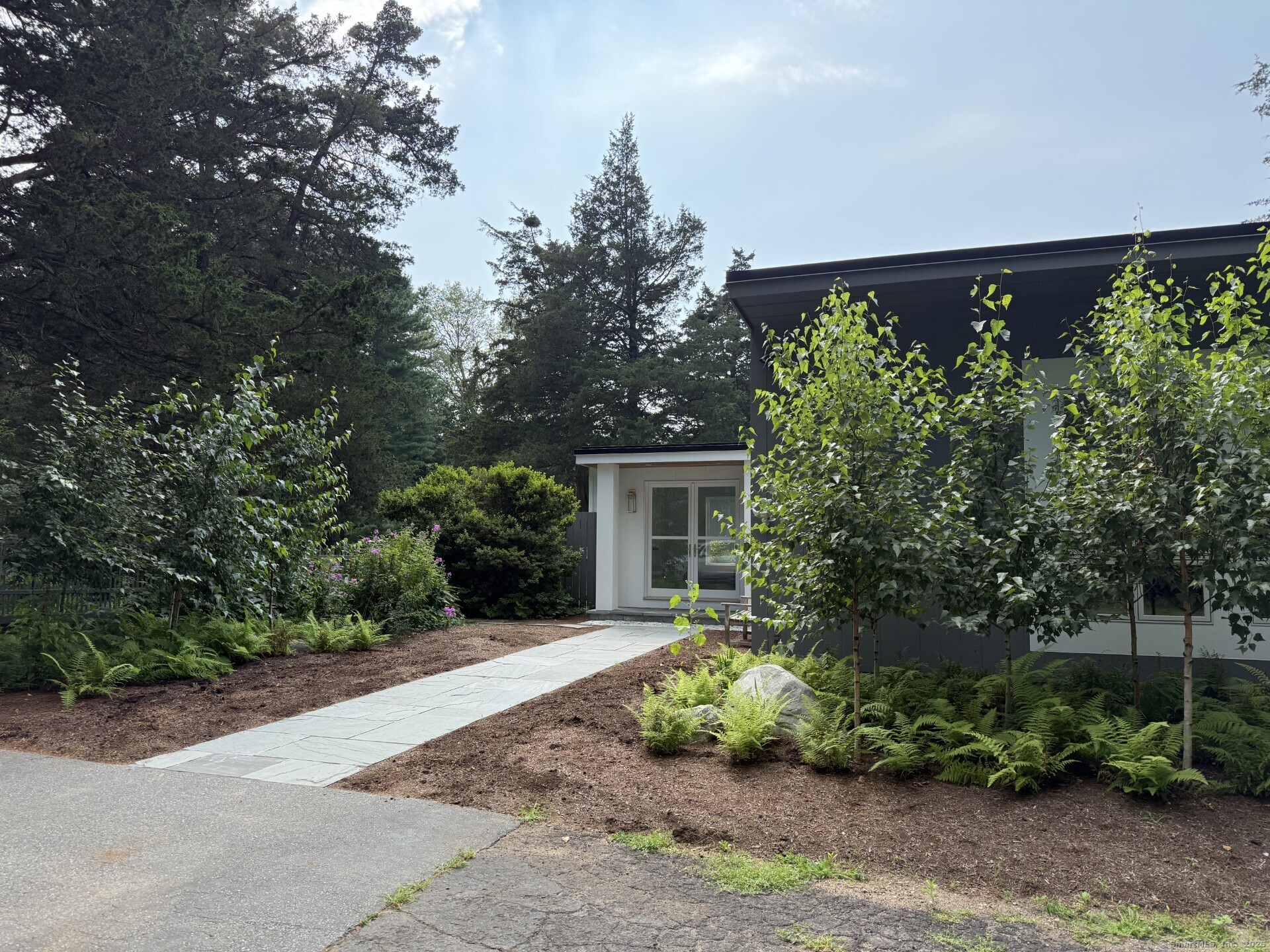 front view of a house with a yard