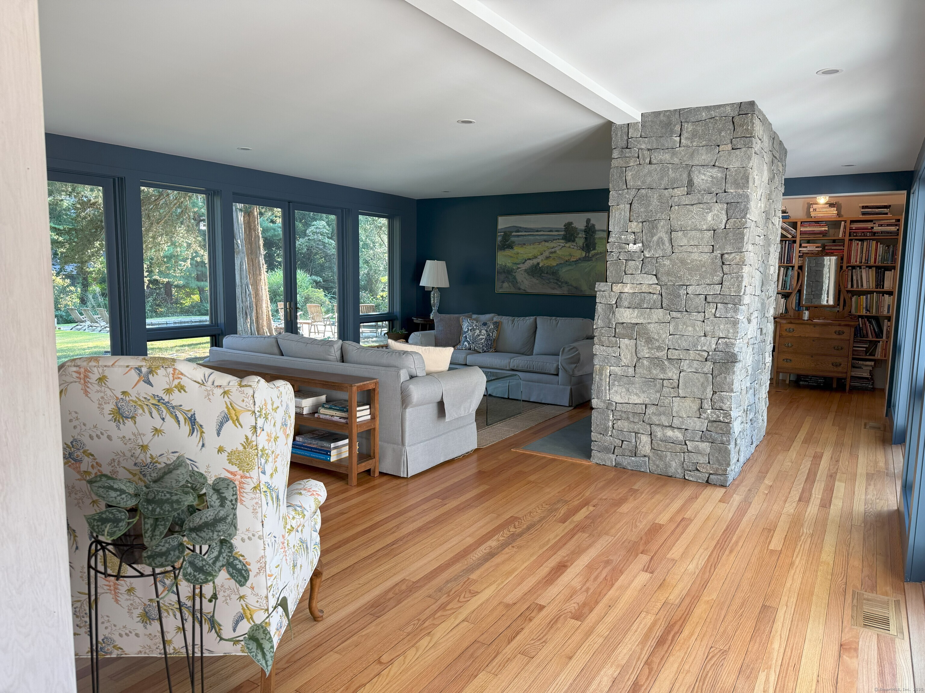 56 Island Avenue Madison, CT 06443 - Photo 12 of 25 a living room with furniture and a fireplace
