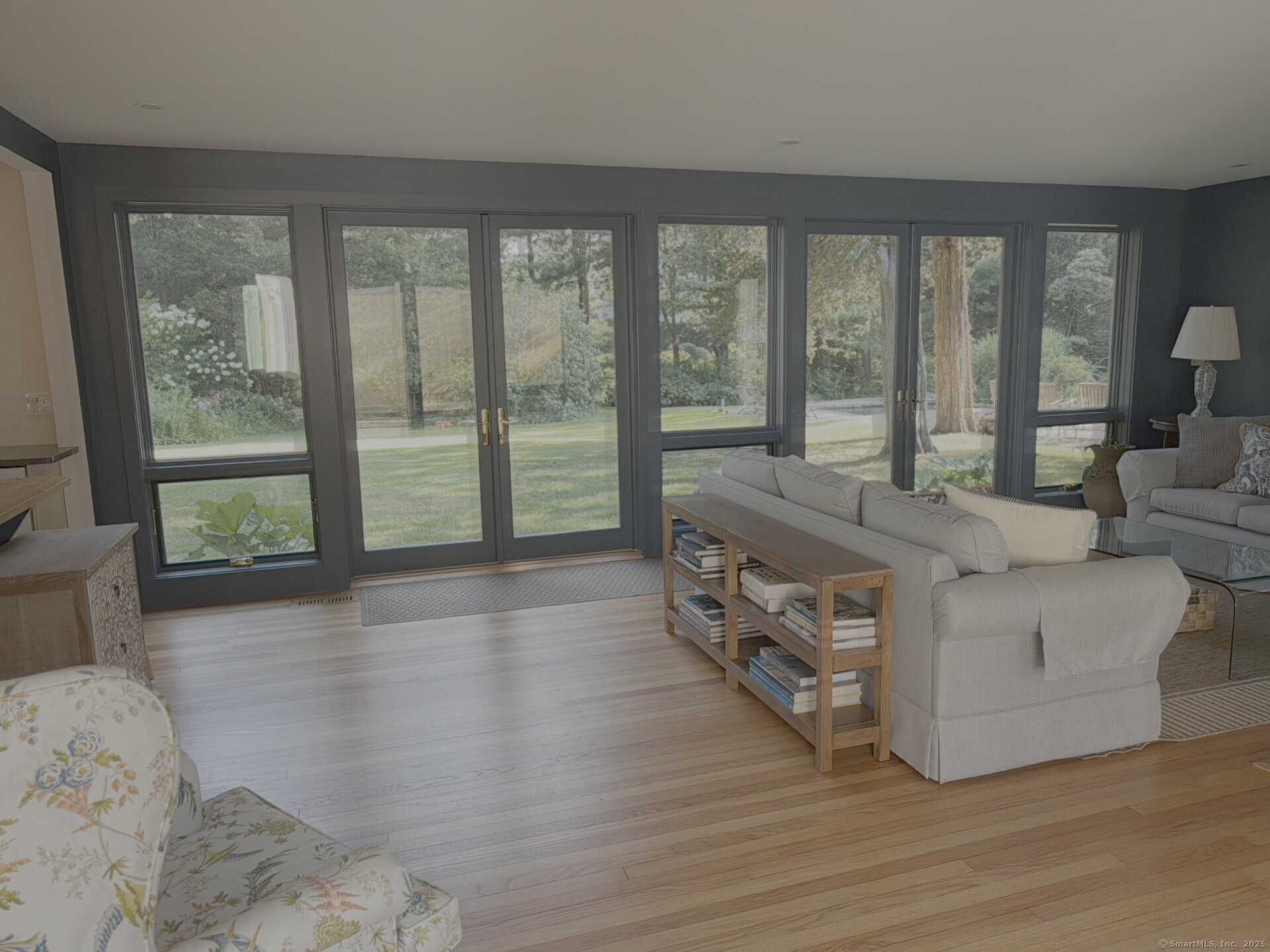 56 Island Avenue Madison, CT 06443 - Photo 13 of 25 a living room with furniture and large windows