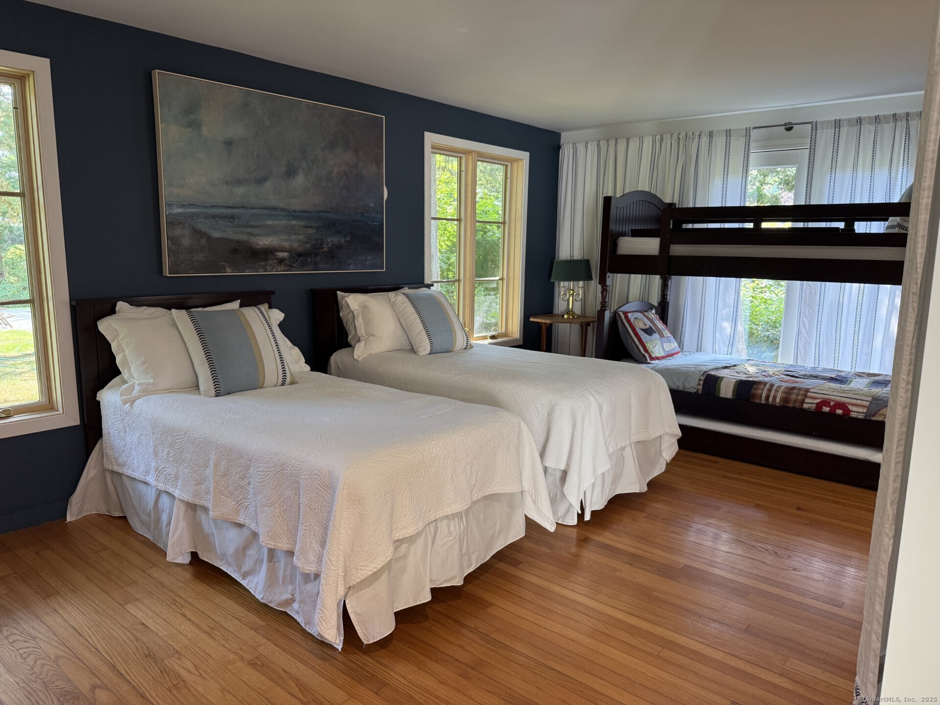 56 Island Avenue Madison, CT 06443 - Photo 14 of 25 a bedroom with a bed and window