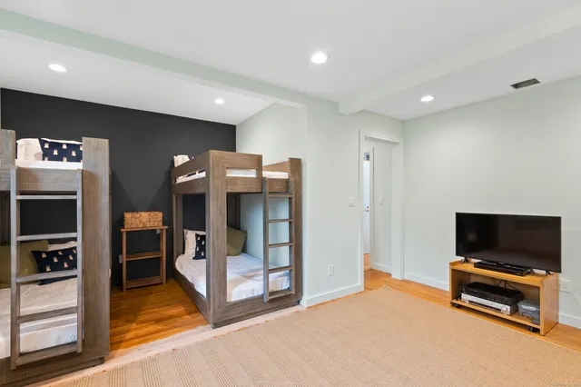 a view of living room with furniture and a flat screen tv