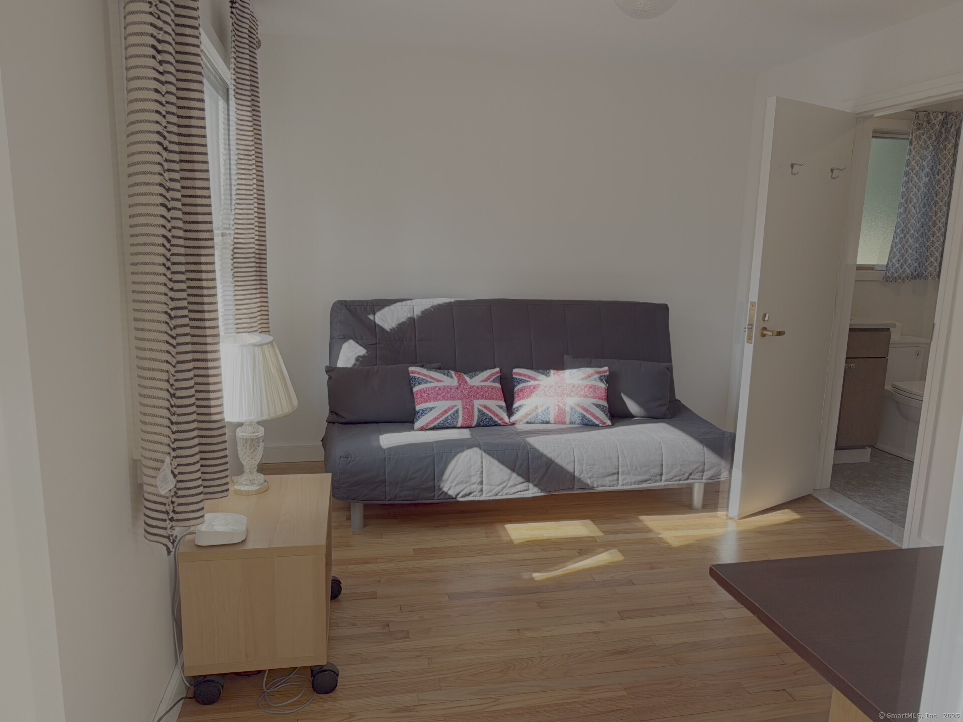 56 Island Avenue Madison, CT 06443 - Photo 8 of 25 a bedroom with bed and a window