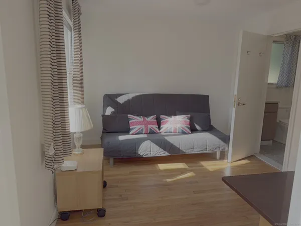 a bedroom with bed and a window