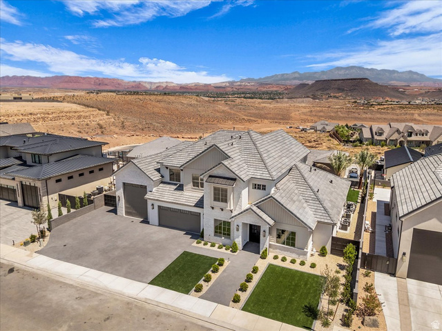 1620 Belayer Drive St. George, UT 84770 - Photo 47 of 51 Contemporary white stucco exterior with multiple gables and a gray tile roof
