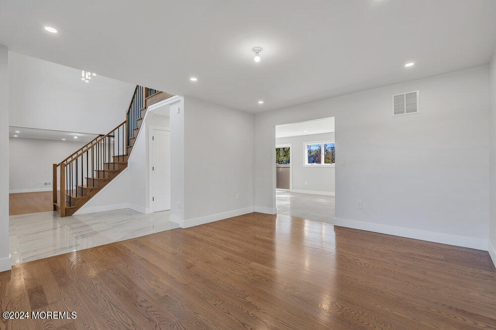 17 Spicy Pond Road Howell, NJ 07731 - Photo 14 of 44 a view of empty room with wooden floor