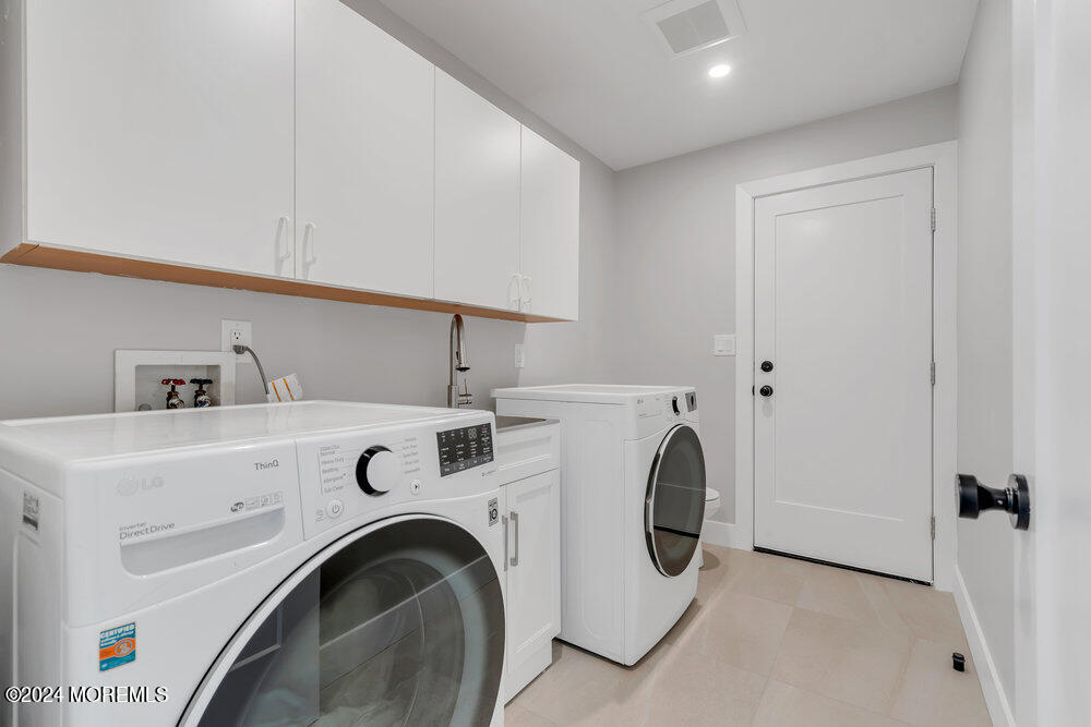 17 Spicy Pond Road Howell, NJ 07731 - Photo 17 of 44 a utility room with dryer and washer