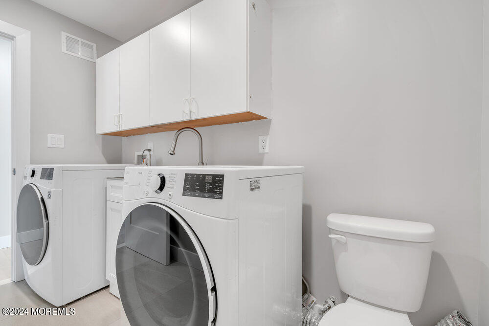 17 Spicy Pond Road Howell, NJ 07731 - Photo 18 of 44 a close view of a washer and dryer