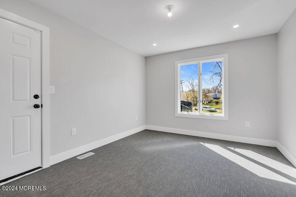 17 Spicy Pond Road Howell, NJ 07731 - Photo 20 of 44 a view of an empty room with a window