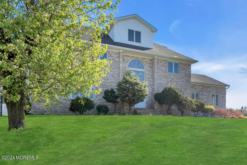 17 Spicy Pond Road Howell, NJ 07731 - Photo 2 of 44 a front view of house with a garden