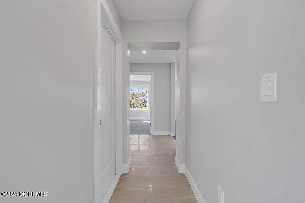 17 Spicy Pond Road Howell, NJ 07731 - Photo 23 of 44 a view of a hallway with wooden floor