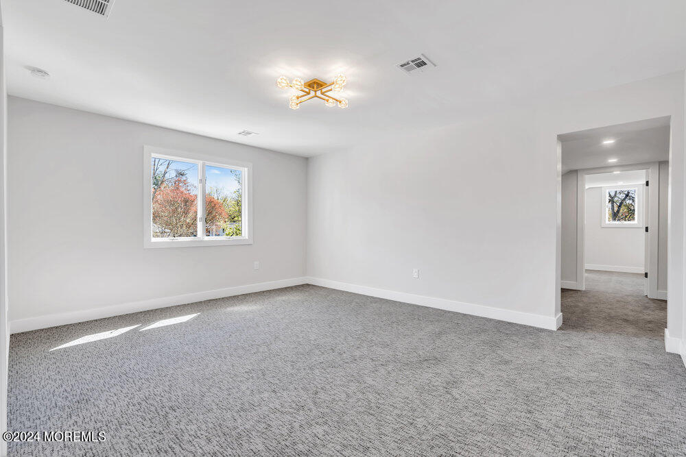 17 Spicy Pond Road Howell, NJ 07731 - Photo 30 of 44 a view of an empty room with a window