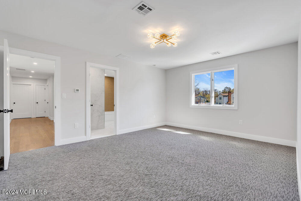17 Spicy Pond Road Howell, NJ 07731 - Photo 31 of 44 a view of an empty room with a chandelier fan