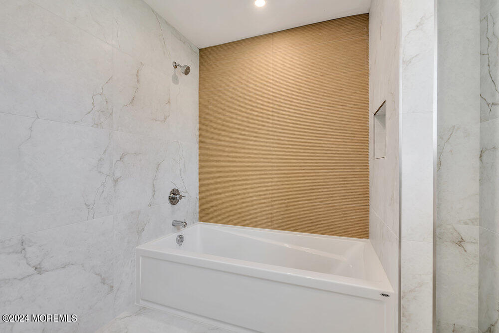 17 Spicy Pond Road Howell, NJ 07731 - Photo 36 of 44 a bathroom with a bathtub