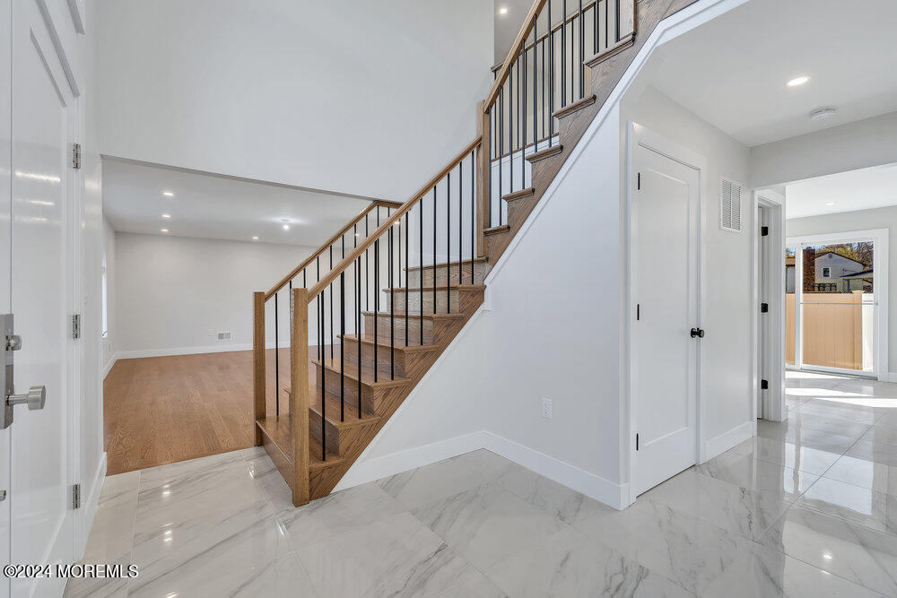 17 Spicy Pond Road Howell, NJ 07731 - Photo 4 of 44 a view of a hallway with staircase