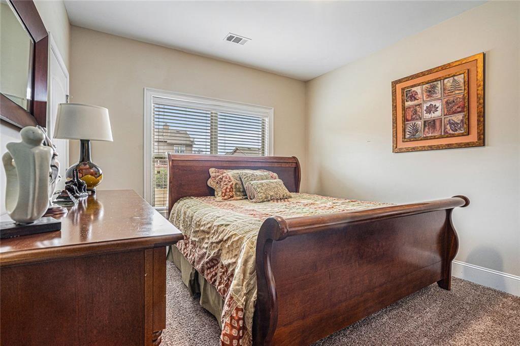 3478 In Bloom Way Auburn, GA 30011 - Photo 21 of 32 a bedroom with a bed and window