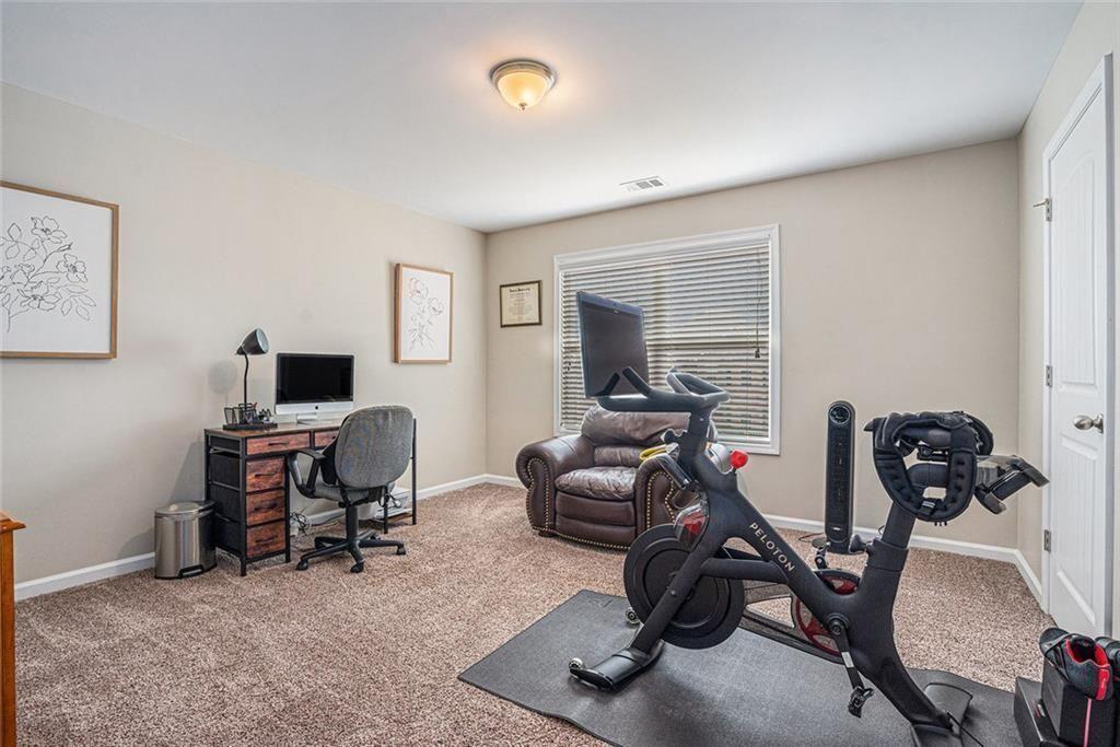 3478 In Bloom Way Auburn, GA 30011 - Photo 28 of 32 a view of a room with gym equipment