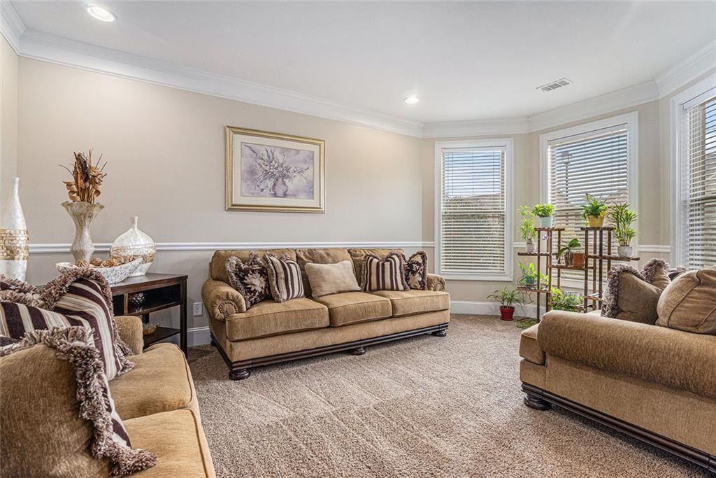 3478 In Bloom Way Auburn, GA 30011 - Photo 5 of 32 a living room with furniture and a large window