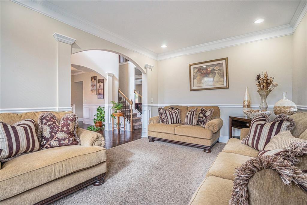 3478 In Bloom Way Auburn, GA 30011 - Photo 6 of 32 a living room with furniture and a couch
