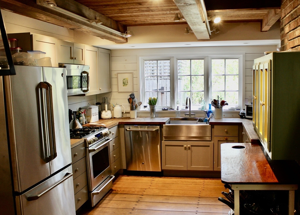225 Lamberts Cove Road West Tisbury, MA 02568 - Photo 10 of 33 a kitchen with stainless steel appliances granite countertop a refrigerator a stove and a sink