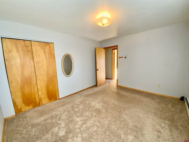 a view of a room with sliding door and wooden floor