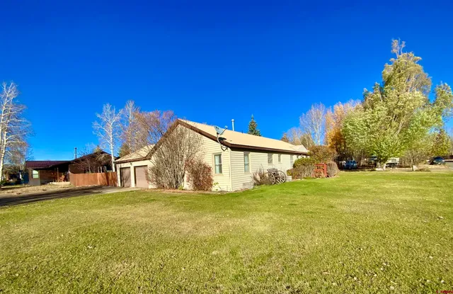 a view of a house with a big yard