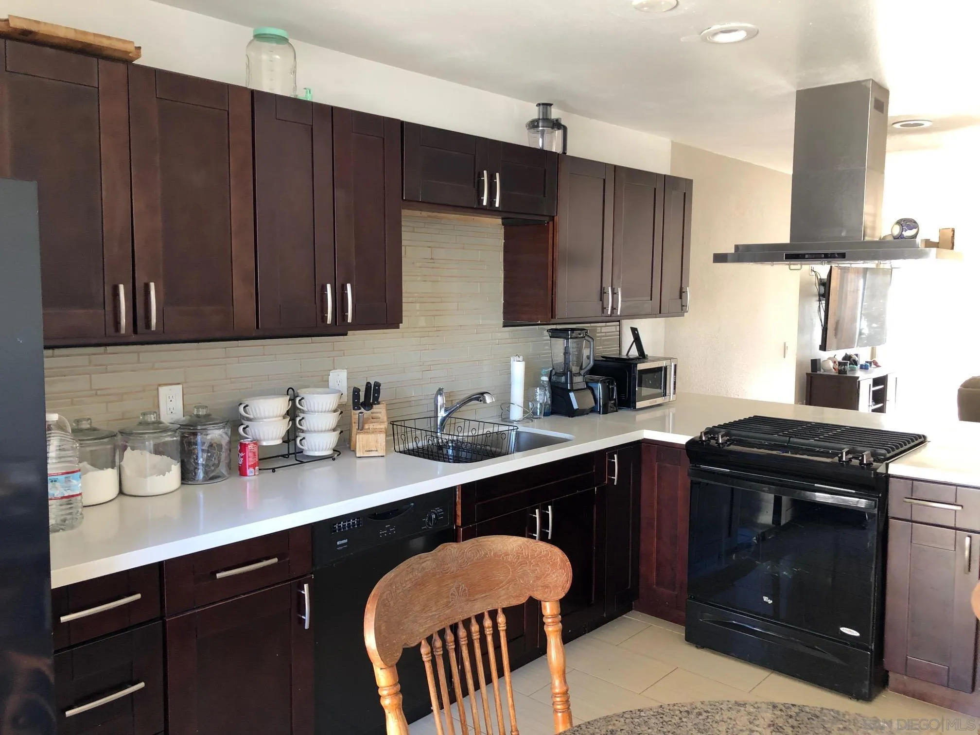 1935 Terracina Circle Spring Valley, CA 91977 - Photo 2 of 5 a kitchen with stainless steel appliances granite countertop a sink stove and cabinets