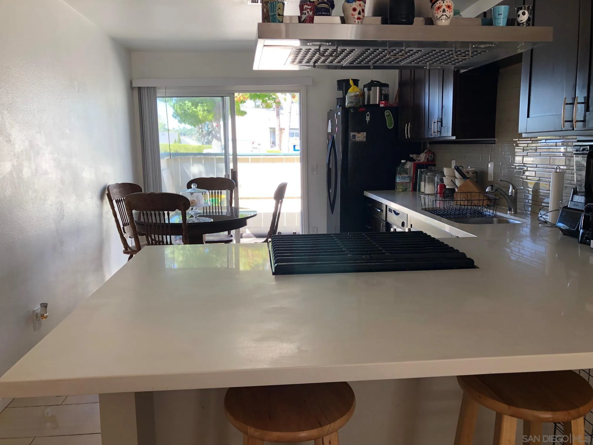 1935 Terracina Circle Spring Valley, CA 91977 - Photo 3 of 5 a view of a kitchen with dining table and chairs