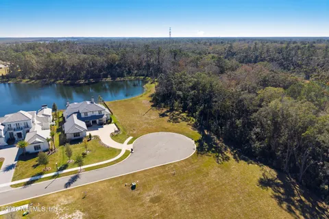 a aerial view of a house with a swimming pool and outdoor space