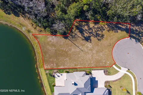an aerial view of a house with a swimming pool