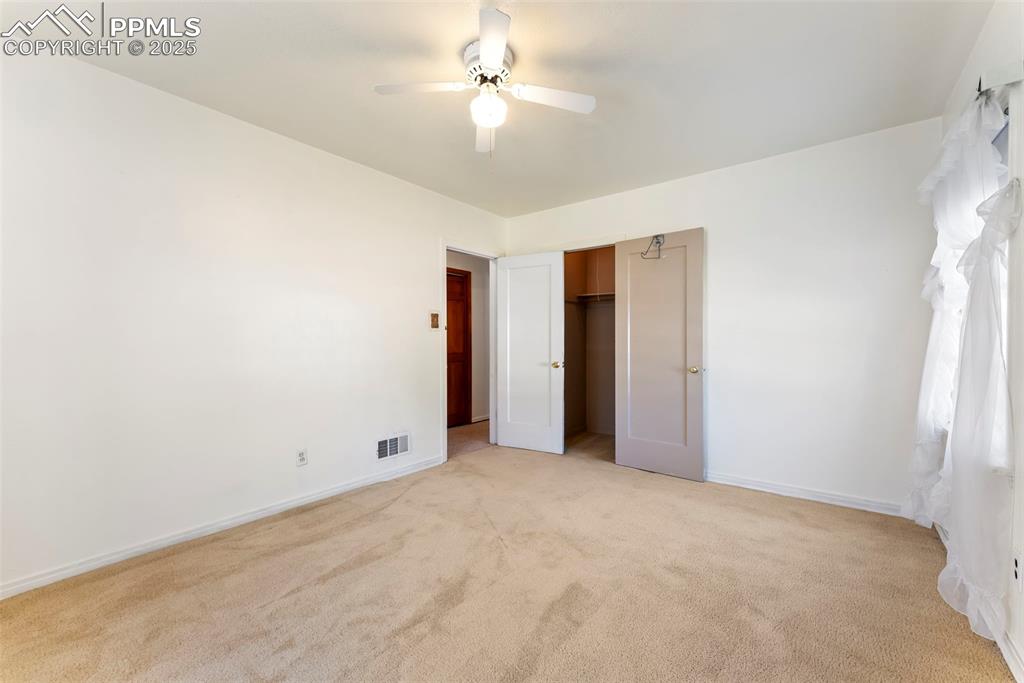 632 North Foote Avenue Colorado Springs, CO 80909 - Photo 17 of 30 a view of an empty room with a ceiling fan