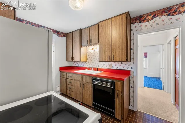 a room with a stove and a cabinet