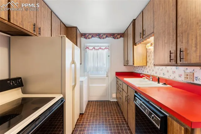 a kitchen with a sink stove and refrigerator