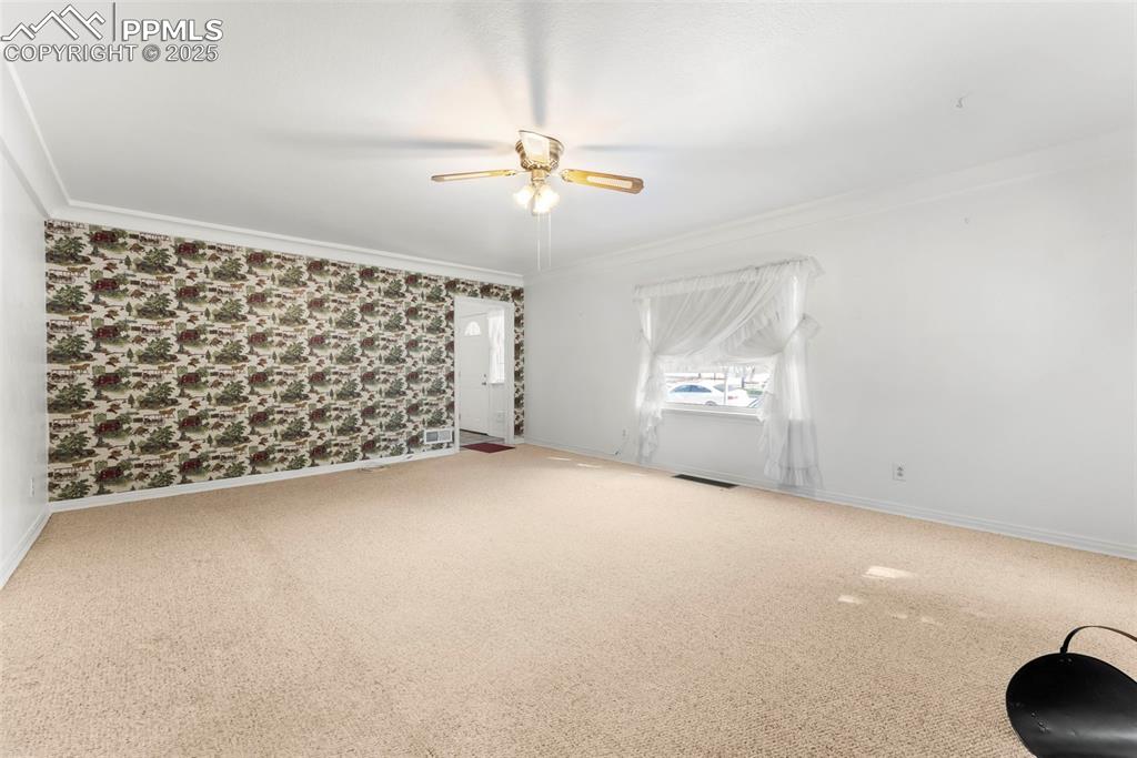 632 North Foote Avenue Colorado Springs, CO 80909 - Photo 6 of 30 en empty room with windows and ceiling fan