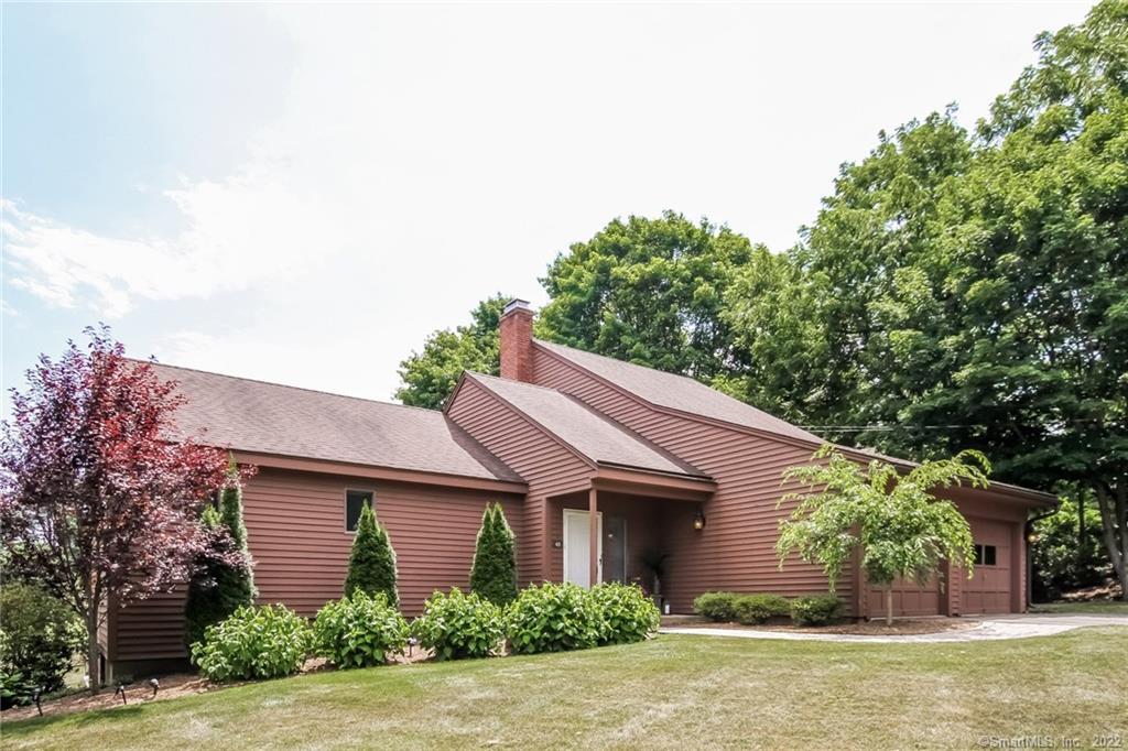 45 Burr Road Bloomfield, CT 06002 - Photo 1 of 1 a front view of a house with garden