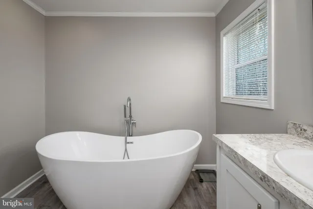 a white bath tub sitting in a bathroom