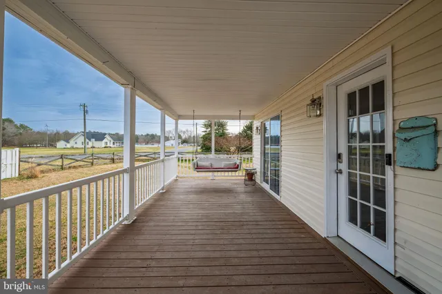 a view of a balcony with wooden floor