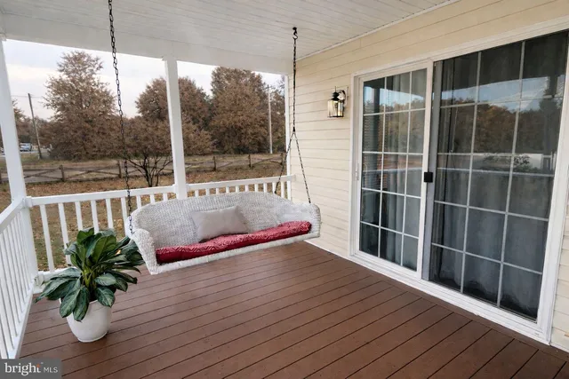 a view of balcony with wooden floor and outdoor space