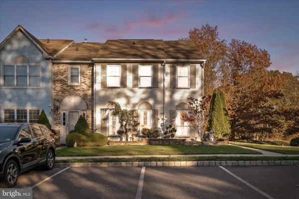 a view of a house with a yard and balcony