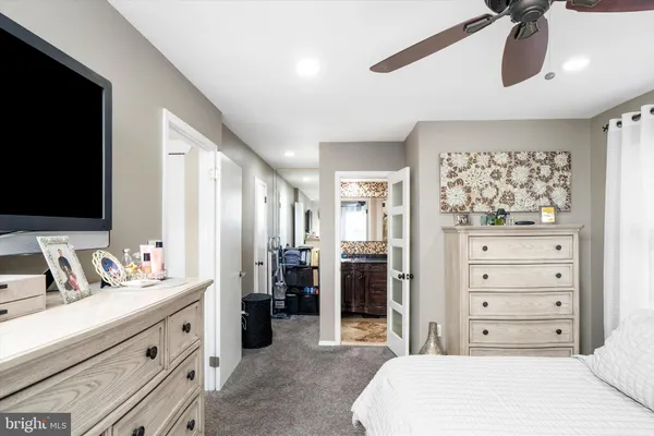 a spacious bathroom with a double vanity sink and a mirror