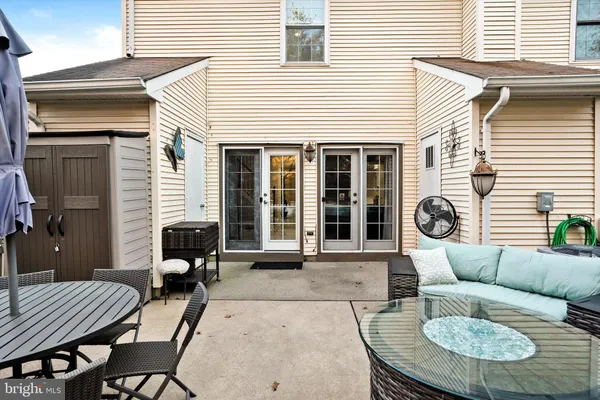 a view of a patio with couple of chairs in patio
