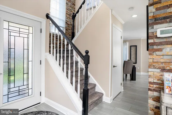 a view of an entryway with staircase