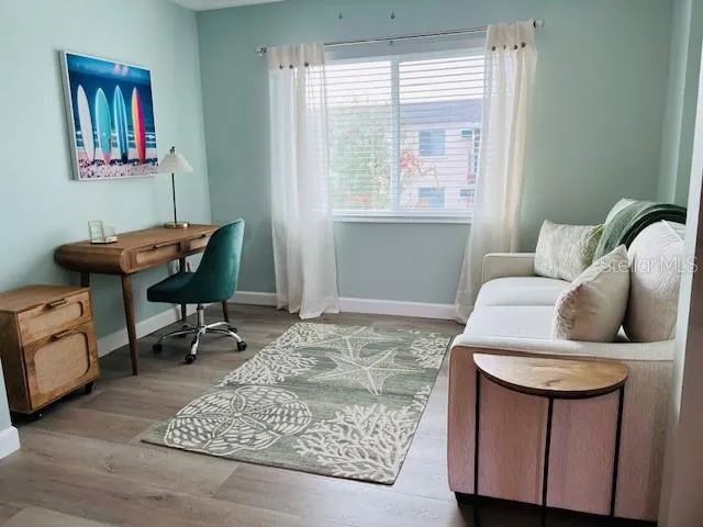 a living room with furniture and a window