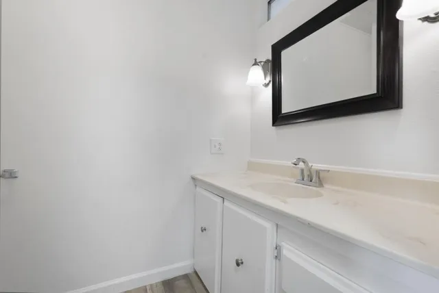 a bathroom with a sink and a mirror