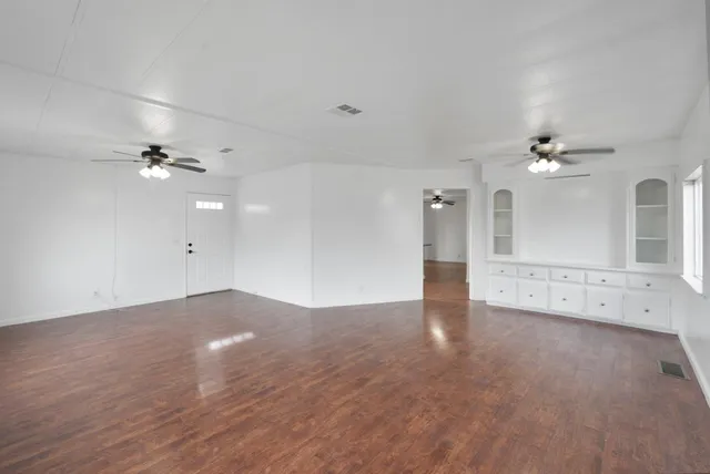 a view of an empty room with a window