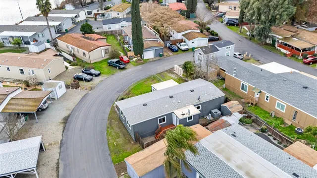 an aerial view of a houses with outdoor space
