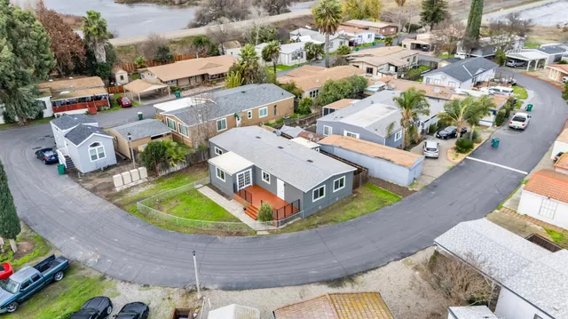 an aerial view of a house with a swimming pool yard and outdoor seating