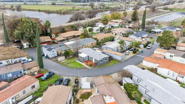 an aerial view of a house with a lake view