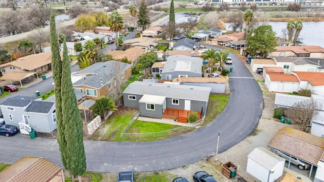 an aerial view of residential houses with outdoor space